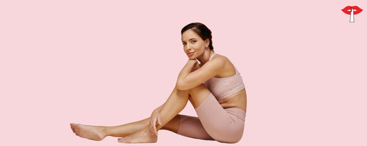 Woman wearing nude shapewear sitting gracefully on a pastel background - comfortable body shaper for Indian women by Gossip Store that smooths curves and enhances confidence 