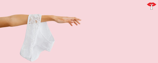 Soft cotton women's panty held against pastel background - breathable, skin friendly lingerie options compared to synthetic panties for everyday comfort.