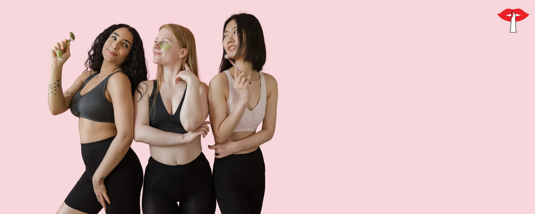 Three women wearing supportive sports bras on a pink background - fitness lingerie for women in India designed to prevent sagging and provide all day comfort